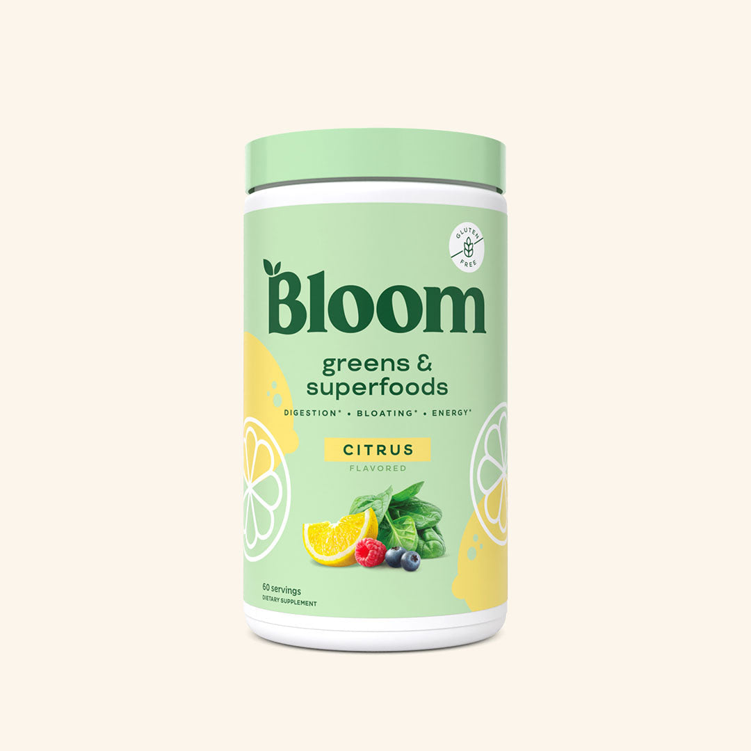 A container of Bloom greens & superfoods powder in Citrus flavor, labeled as supporting digestion, bloating, and energy. 60 servings.